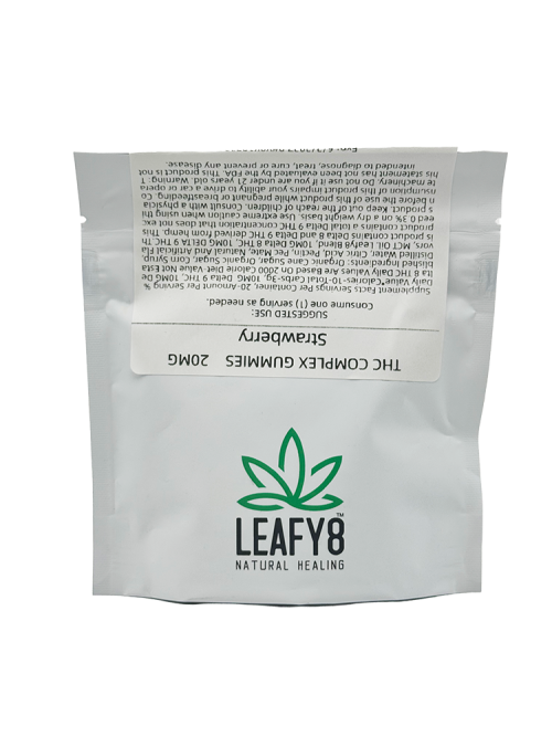 A close-up view of the product label for Leafy8 Strawberry THC Complex 20mg Gummies, displaying detailed supplement facts including a multi-cannabinoid formulation of 10mg Delta 8 THC and 10mg Delta 9 THC per serving. The premium, lab-tested hemp-derived distillate confection packaging highlights suggested use and transparent ingredient compliance.